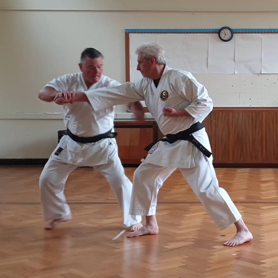 Wrist turns away and downward while maintaining elbow pressure